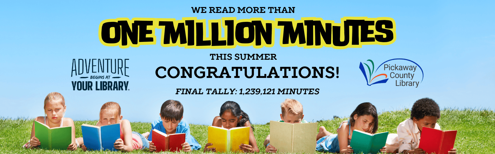 Children laying on their tummies in a row reading colorful books in the grass. Congratulations on reading more than 1 million minutes.